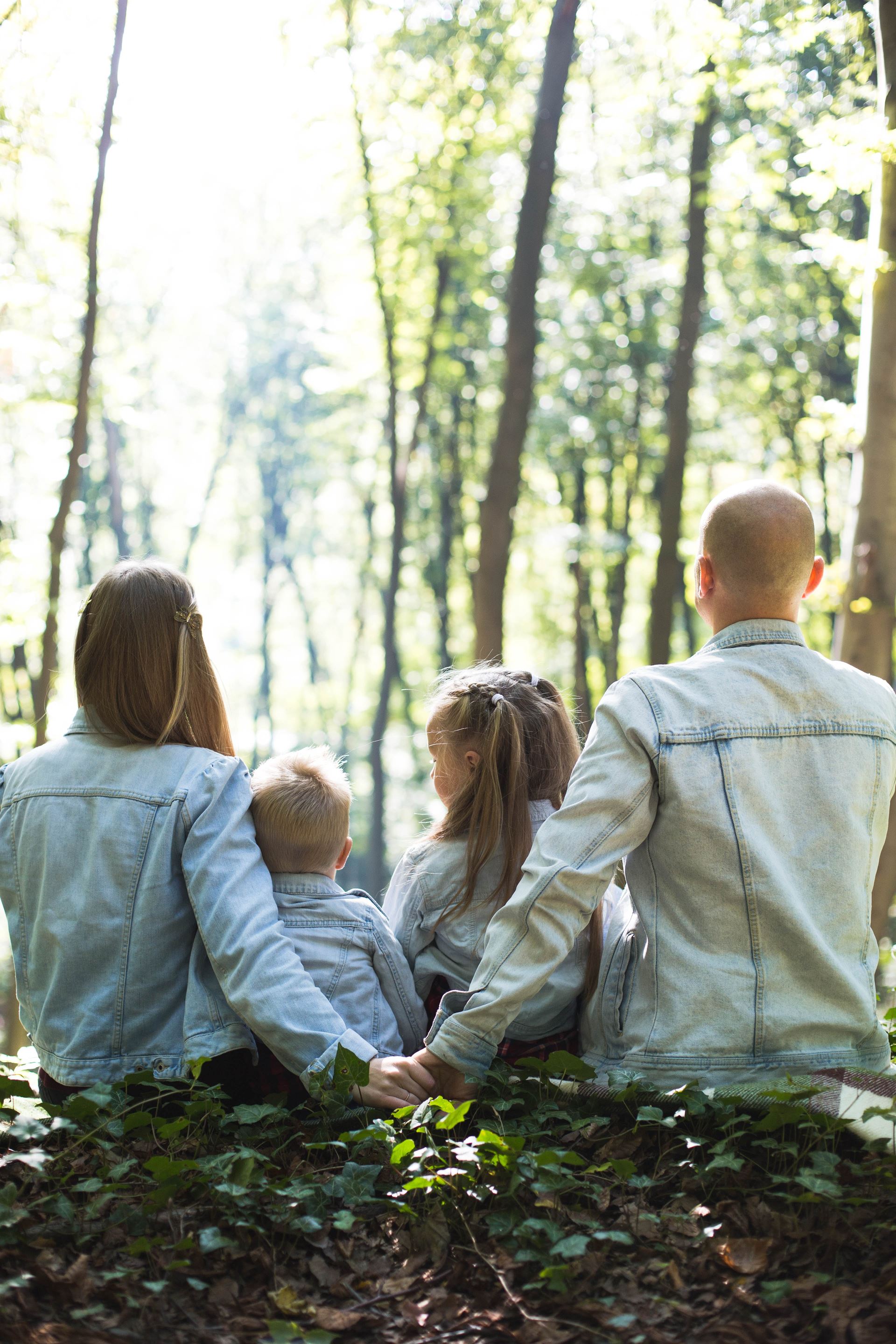 a family walking together in the woods