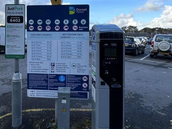 A Dorset Council Car Park sign and payment machine